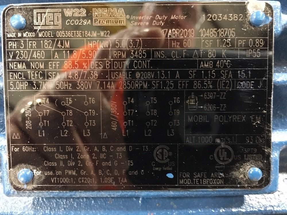 WEG severe-duty motor nameplate photographed with glare